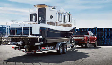 2022 Nissan TITAN Truck towing boat | Greeley Nissan in Greeley CO